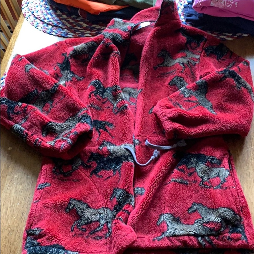 Fleece jacket with horses on it